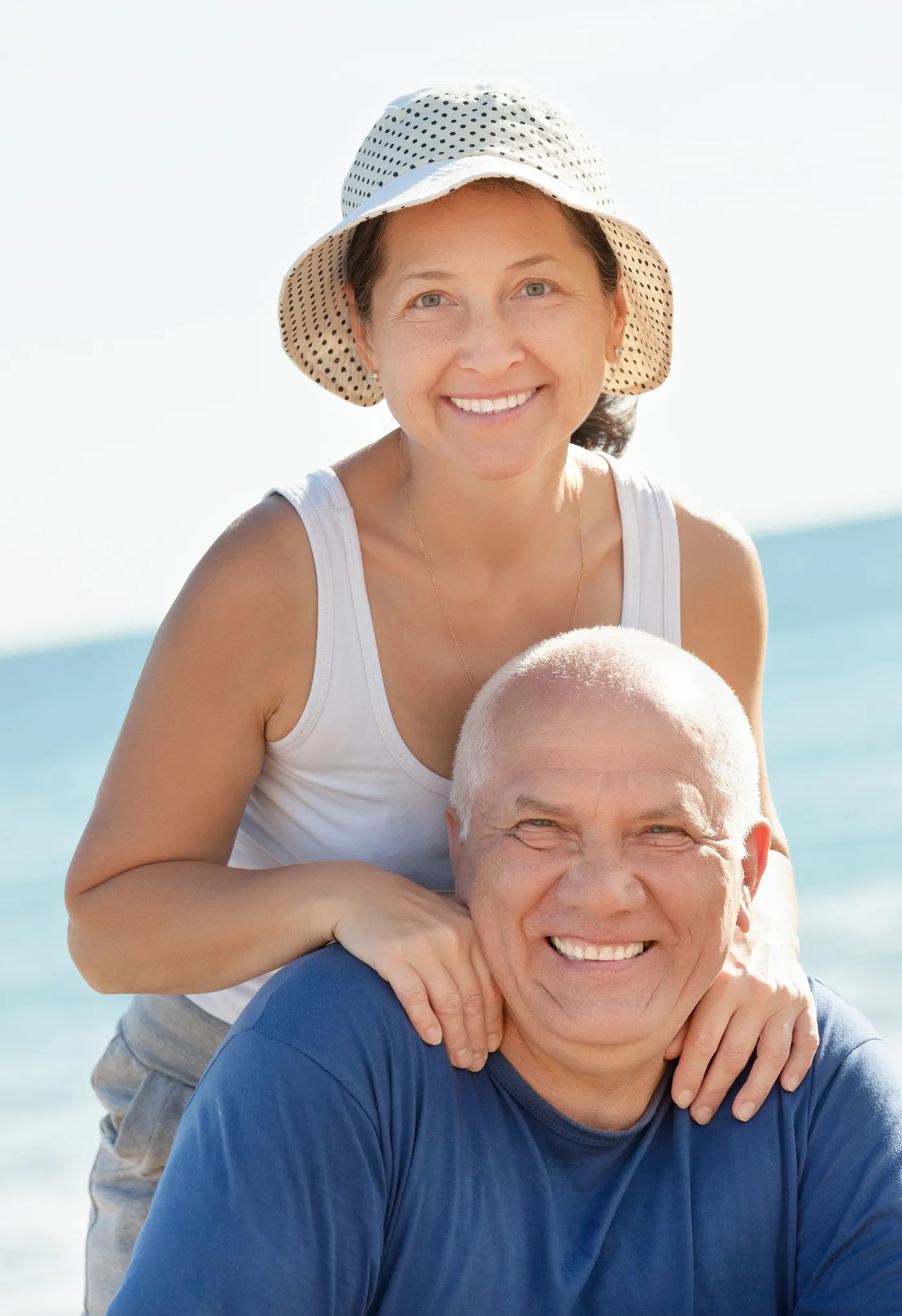 Happy older couple smiling together, enjoying life in Mexico