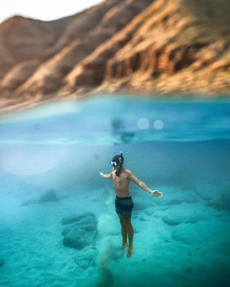 Snorkeler exploring the turquoise waters of the Sea of Cortez